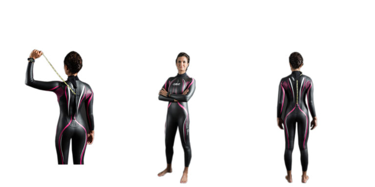 Femme en combinaison de plongée, prête pour l'exploration sous-marine et les aventures aquatiques.