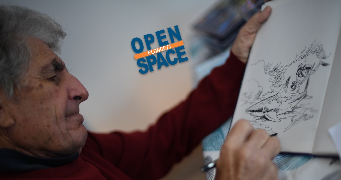 Artiste illustrant la vie marine avec un dessin de requin et plongeur.